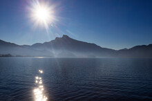Austria, Upper Austria, Sun Rising Over Mondsee Lake With Schafberg Mountain In Background