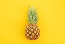 Ripe Pineapple Isolated On White Background. Bright Pineapple In Minimal Style. Fresh Pineapples On Blue Background. Tropical Fruits. Vegetarianism. Summer Fruits.