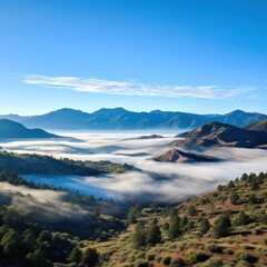 Wall Mural - Hazy mountains seen through wispy clouds