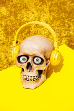 Skull In Headphones On Yellow Backdrop