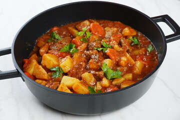 Wall Mural - Traditional homemade Hungarian beef meat stew and soup  - Goulash with potatoes, carrots , tomatoes, bell pepper