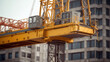 © IndigoElf - Construction crane on the background of houses in the city. Construction site of a new residential complex concept. Sunny day.