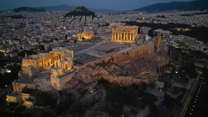 Wall Mural - Aerial view of the illuminated Parthenon ans Athena Nike Temple at the Acropolis of Athens, Greece, during evening time