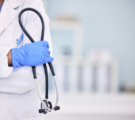 Wall Mural - Doctor, hand and stethoscope of professional with arms crossed for medical or healthcare at hospital. Closeup of nurse or surgeon holding tool or equipment in cardiology, health or wellness at clinic