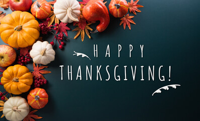 Wall Mural - thanksgiving and autumn decoration concept made from autumn leaves and pumpkin on dark background. f