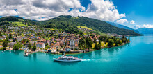 Oberhofen Panoramic View At Lake Thunersee In Swiss Alps, Switzerland. Town Of Oberhofen On The Lake Thun (Thunersee) In Bern Canton Of Switzerland. Oberhofen Town On Lake Thun, Switzerland.