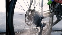 Cleaning Bicycle Rear Derailleur Close Up Video. Washing Gravel Bicycle.Bike Mechanic Cleaning Dirty Gravel Bike Outside. Washing A Bike.Cycling Sport. 