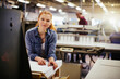 © Geber86 - Portrait of a young Caucasian woman working in a printing press office