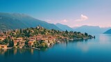 Fototapeta Do pokoju - Beautifull aerial panoramic view from the drone to the Varenna - famous old Italy town on bank of Como lake. High top view to Water landscape with green hills, mountains and city in sunny summer day.