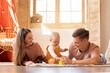 © Prostock-studio - Happy Family Of Three With Little Baby Spending Time Together At Home