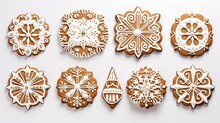 A Set Of Gingerbread Cookies In Patterns On A Plain White Background. The Details Of The Icing Decorations And The Uniformity Of The Layout.