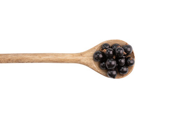 Sticker - photograph of black currant berries in wooden spoon isolated on white background with clipping path, top view