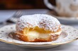 © Pajaros Volando - Close up shot of delicious stuffed donut filled with cream