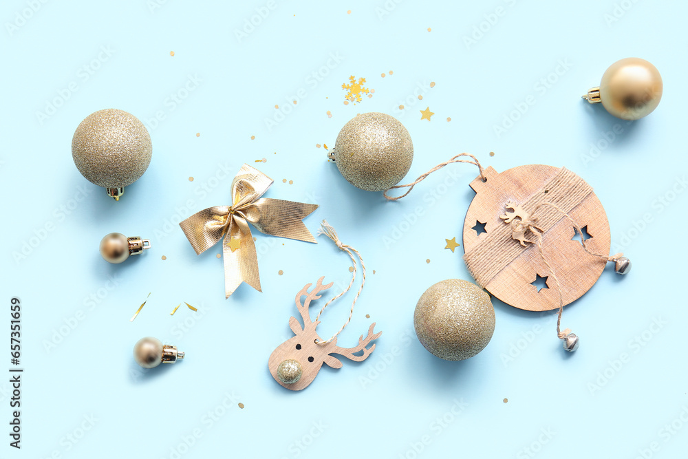 Christmas balls and bow on blue background