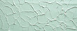 Texture of Celadon Porcelain with a Veined Crackle Glaze A cracked surface with like lines running through it, resulting in a natural and organic texture.