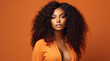 © MariaJos - African american female model, posing, orange clothing, Brazilian deep wave hair, unsplash, peach background