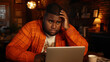 © DesignVectX - A man looking stressed in front of a laptop, possibly dealing with technical issues.