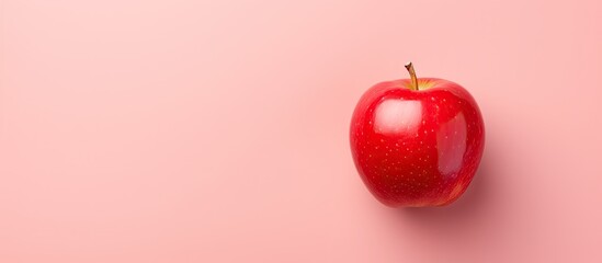Wall Mural - Red apple on a isolated pastel background Copy space