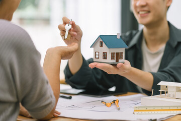 Wall Mural - Real estate agent offers home ownership and life insurance to a senior woman, property investment and house mortgage financial concepts.