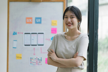Wall Mural - portrait of creative ux ui designer working on screens for mobile responsive website development, fo