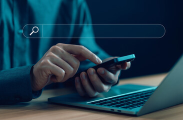 Wall Mural - businessman using a phone, show search bar. concept of a website to find a job and career on the int
