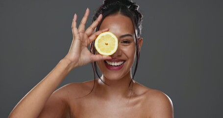 Sticker - Face, skincare and happy woman with lemon for beauty in studio isolated on gray background. Portrait, natural fruits and food of model for cosmetics, healthy diet and nutrition for organic vitamin c