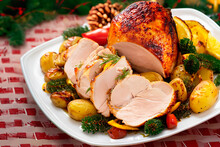 Roasted Turkey Slices Surrounded By Potatoes And Roasted Vegetables On The Christmas Table
