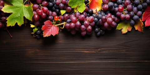 Canvas Print - Black juicy grapes on dark wooden background.