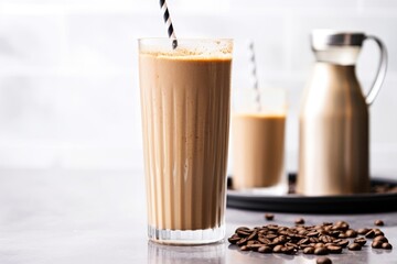 Wall Mural - a coffee shake in a tall glass with a stainless steel straw