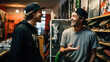 Owner of a small skateboard business talking with friend