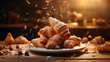 A bunch of croissant on table setting. Sprinkle a little icing sugar on top of it with bokeh background.
