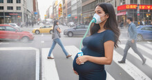 pregnant woman wearing an oxygen mask on city street, polluted air around her