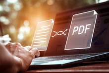Convert PDF Files With Online Programs. Users Convert Document Files On A Platform Using An Internet Connection At Desks. Concept Of Technology Transforms Documents Into Portable Document Formats.