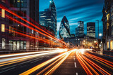Fototapeta Londyn - Speed of light in London city. London red buses zooming through City skyscrapers night street. London rush hour light trails at night.