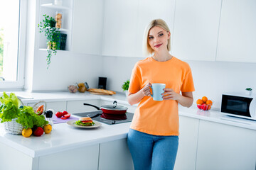 Sticker - Photo of nice lovely girl hold cup on modrning drink breakfast in modern contemporary design kitchen