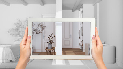 Wall Mural - augmented reality concept. hand holding tablet with ar application used to simulate furniture and de