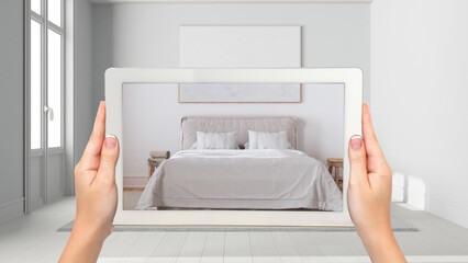 Wall Mural - augmented reality concept. hand holding tablet with ar application used to simulate furniture and de