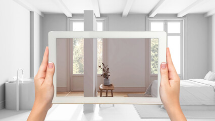 Wall Mural - augmented reality concept. hand holding tablet with ar application used to simulate furniture and de