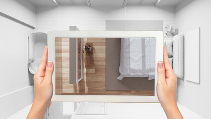 Wall Mural - augmented reality concept. hand holding tablet with ar application used to simulate furniture and de