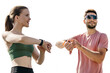 © muse studio - A woman and a man sports athletes use a fitness watch and a running app, runners are friends together training in sports form cardio exercises active lifestyle.   Transparent isolated background.