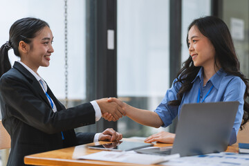 Business partnership meeting concept. Image businessman s handshake. Successful businesswomen handshaking after a good deal.