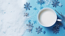 Top View Of White Cup On Blue Background With Decorative Snowflakes And Snow. Empty Space For Product Placement Or Advertising Text.