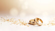 © Stock Love - Wedding rings from red gold on light bokeh background. Gold wedding rings. Minimalistic rings for wedding, proposal. Saint Valentine Day rings. Ring photo for ads or catalog. Simple wedding rings