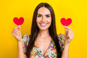 Canvas Print - Photo of positive adorable lady wear bright summer clothes showing red paper cards isolated on yellow color background