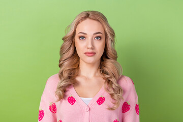 Poster - Portrait of confident blond hair lady seriously person look forward wear pink shirt cardigan isolated green pastel color background