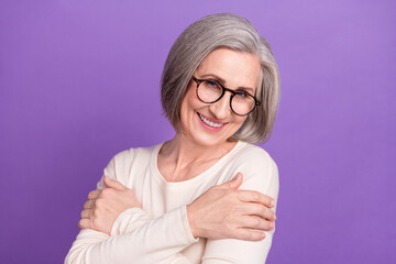 Sticker - Closeup photo of attractive funny pensioner business lady embracing herself need psychological support isolated on violet color background