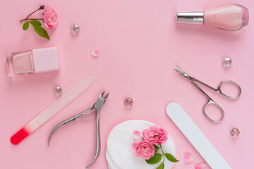 Wall Mural - Composition of manicure and pedicure tools on pink background, flat lay. Cream, nail polish, file, scissors. Professional equipment for nail care. Beauty care concept for banner design.