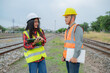 © reewungjunerr - Two engineer working at train station,Work together happily,Help each other analyze the problem,Consult about development guidelines