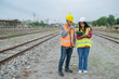 © reewungjunerr - Two engineer working at train station,Work together happily,Help each other analyze the problem,Consult about development guidelines
