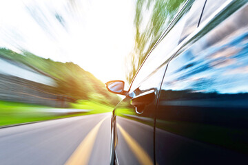 Poster - Car in motion blur driving in the forest